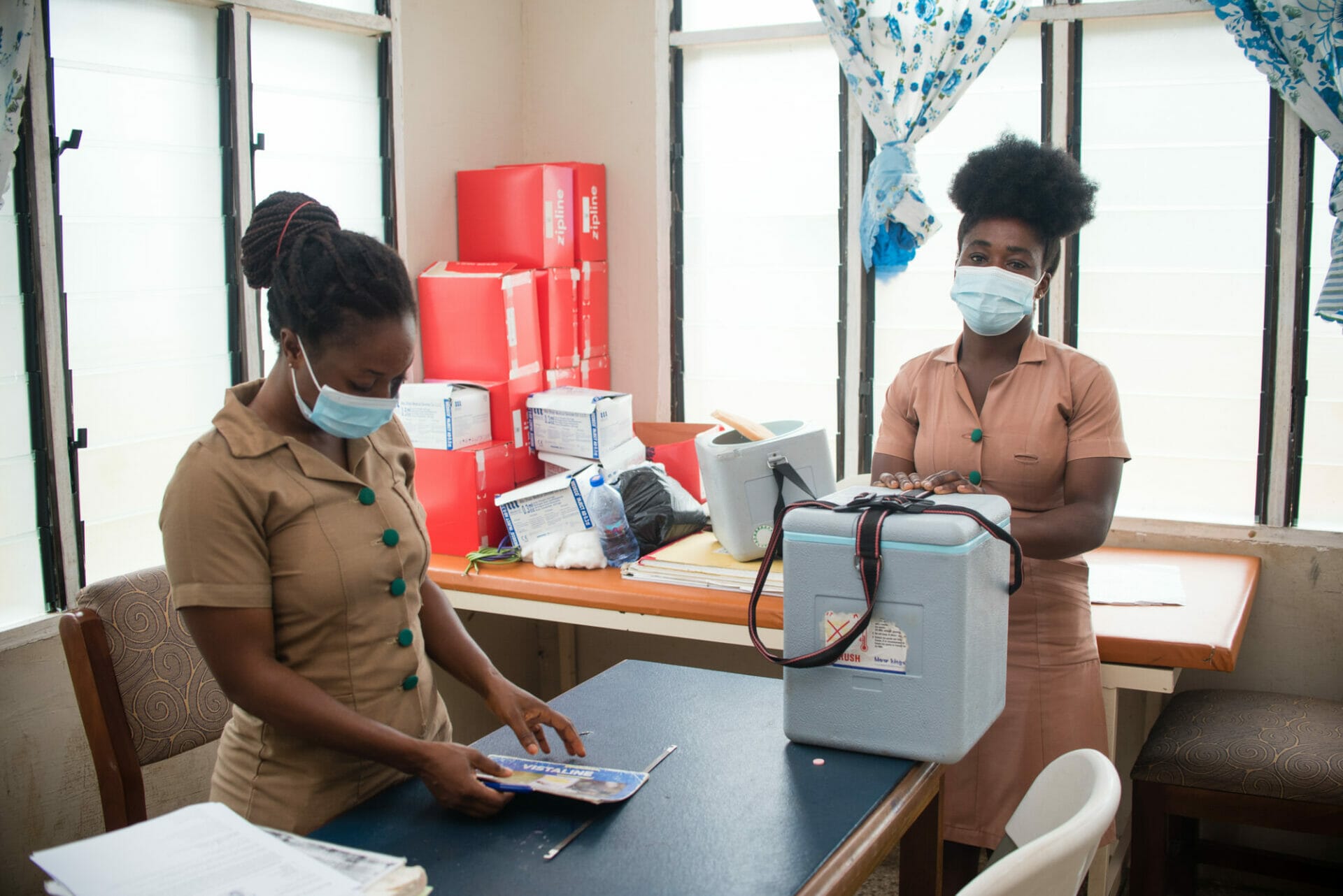 KTP-963 Community health nurses loading their vaccination boxes with vaccines for an outreach