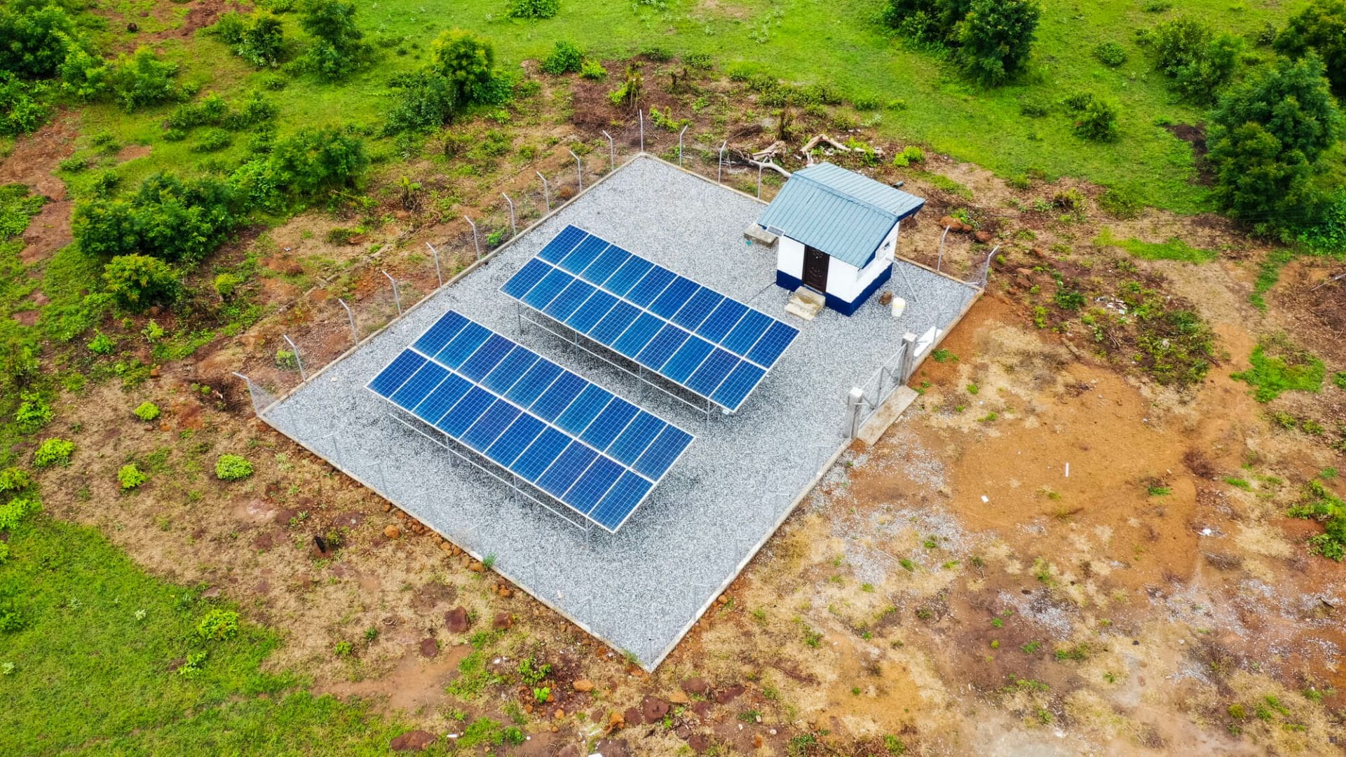 Aerial view of a pump house powered by solar energy for small town water system
