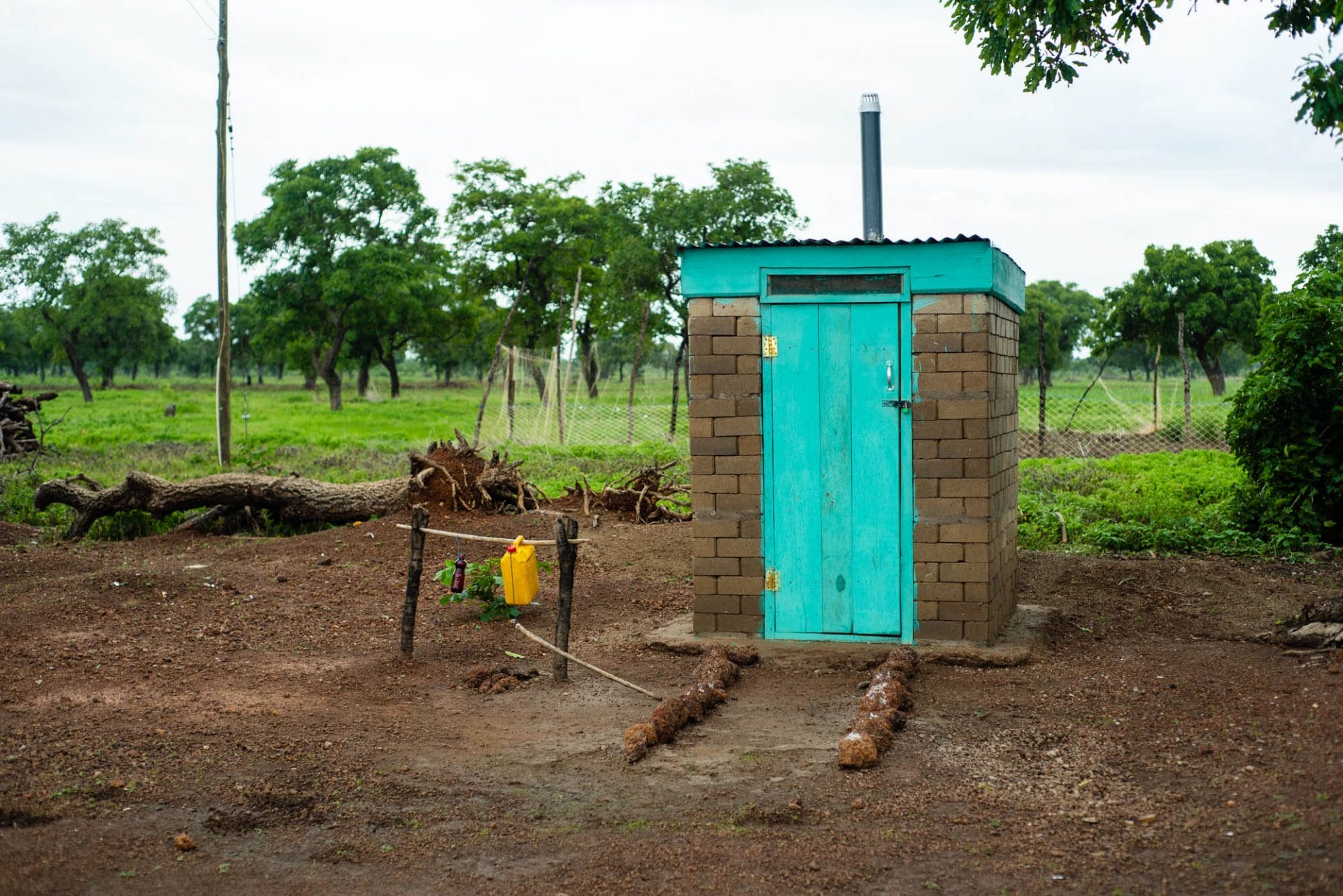 A household latrine constructed with interlocking blocks with an installed Digni-Loo